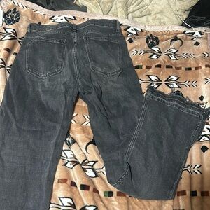 black flared jeans with some fraying on the bottom! cute for a western outfit